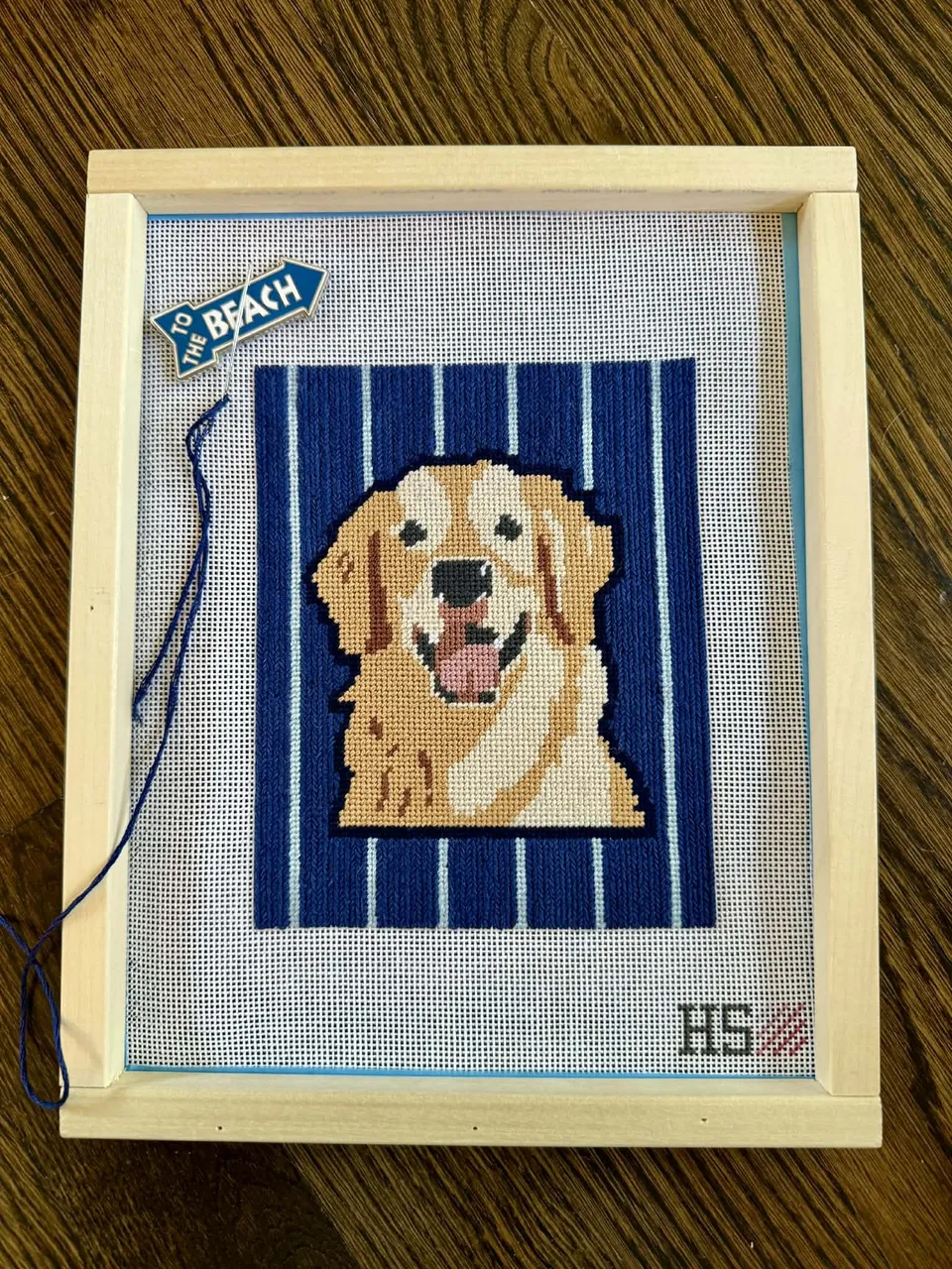 A finished dog needlepoint canvas